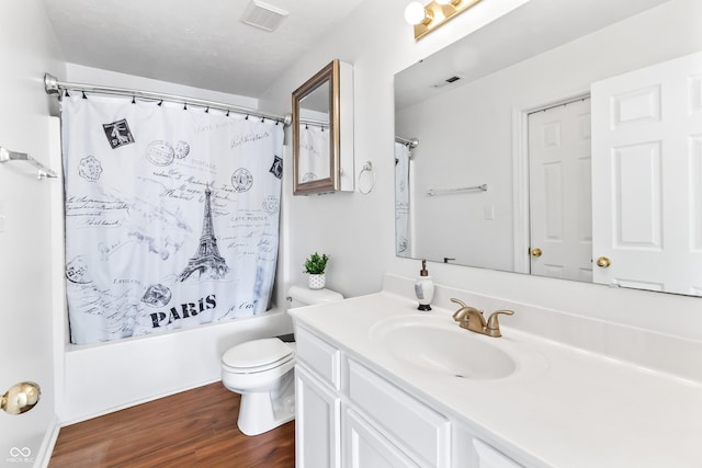 2326 Gradison Cir, Indianapolis, IN 46214 - bathroom with vanity, shower / bath combo, toilet, and wood finished floors