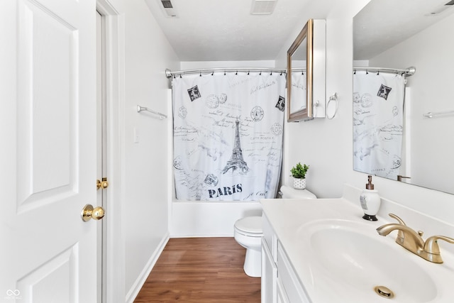 2326 Gradison Cir, Indianapolis, IN 46214 - full bath with vanity, toilet, wood finished floors, shower / bath combination with curtain, and baseboards