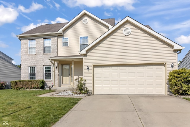 2326 Gradison Cir, Indianapolis, IN 46214 - traditional home featuring driveway, an attached garage, a front yard, and central AC