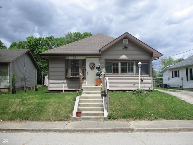 29 Home Ave, Markleville, IN 46056 - bungalow-style house featuring a front yard, central air condition unit, and roof with shingles