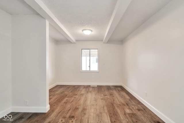 3242 Welch Dr, Indianapolis, IN 46224 - spare room with wood finished floors, baseboards, and a textured ceiling