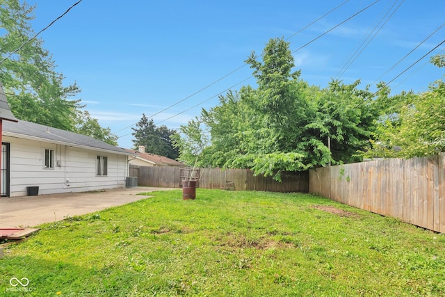 3242 Welch Dr, Indianapolis, IN 46224 - view of yard featuring a patio area and central AC unit