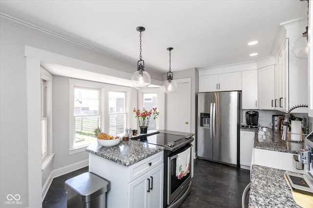 831 Weghorst St, Indianapolis, IN 46203 - kitchen with stainless steel appliances, white cabinets, light stone counters, decorative light fixtures, and recessed lighting
