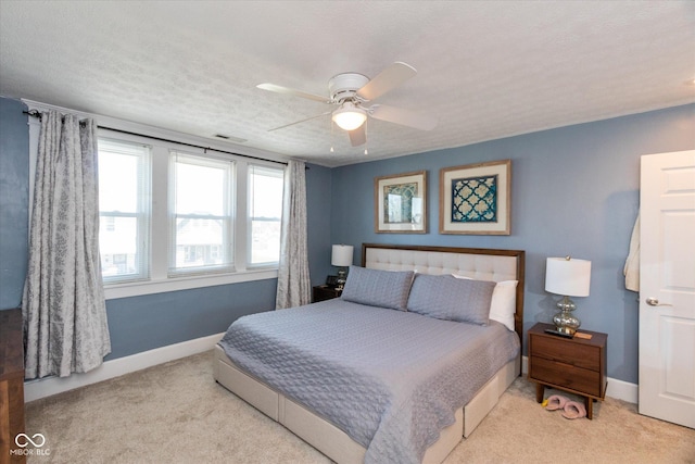 831 Weghorst St, Indianapolis, IN 46203 - bedroom featuring carpet floors, baseboards, ceiling fan, and a textured ceiling