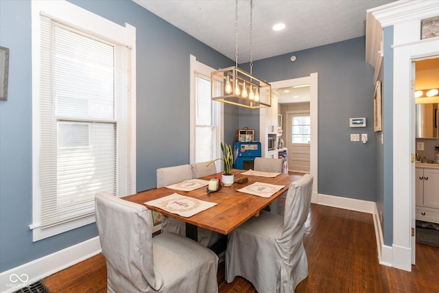 831 Weghorst St, Indianapolis, IN 46203 - dining room with dark wood-style floors, baseboards, a chandelier, and recessed lighting