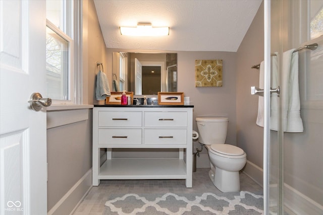 831 Weghorst St, Indianapolis, IN 46203 - full bathroom with toilet, vanity, a shower stall, a textured ceiling, and baseboards
