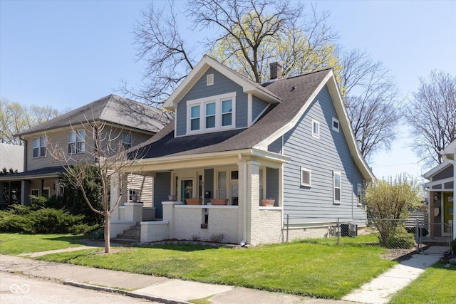 831 Weghorst St, Indianapolis, IN 46203 - bungalow-style home featuring covered porch, a chimney, central AC, and roof with shingles