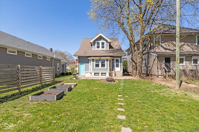 831 Weghorst St, Indianapolis, IN 46203 - back of house with a vegetable garden