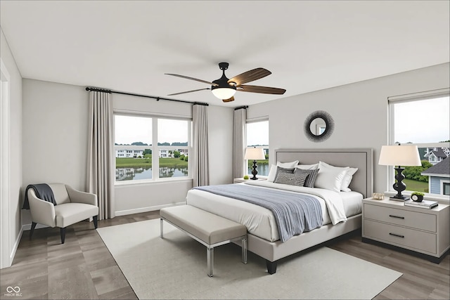 6762 Brentwood Ct, Brownsburg, IN 46112 - bedroom with a ceiling fan, light wood-style flooring, baseboards, and a water view
