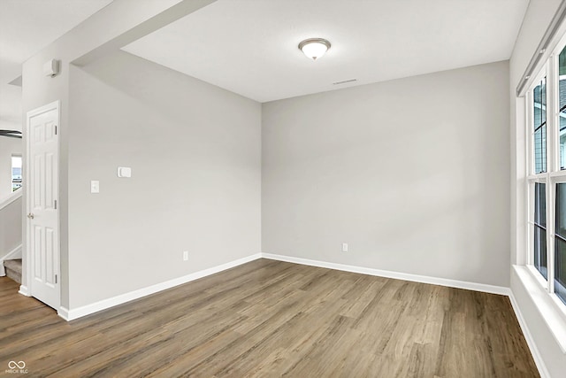 6762 Brentwood Ct, Brownsburg, IN 46112 - empty room with wood finished floors, baseboards, and stairway