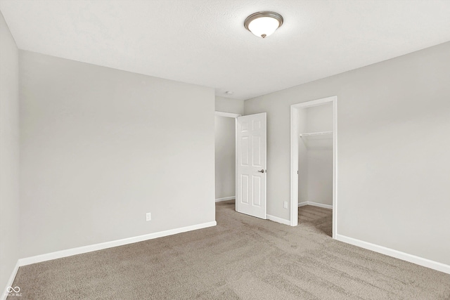 6762 Brentwood Ct, Brownsburg, IN 46112 - unfurnished bedroom with carpet, baseboards, a spacious closet, and a closet