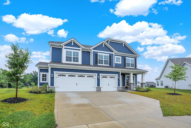 6762 Brentwood Ct, Brownsburg, IN 46112 - craftsman house with a garage, a front yard, concrete driveway, and a porch
