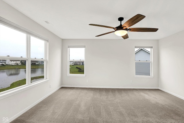 6762 Brentwood Ct, Brownsburg, IN 46112 - carpeted spare room with plenty of natural light, a water view, and a ceiling fan