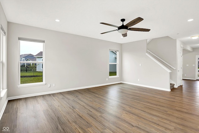 6762 Brentwood Ct, Brownsburg, IN 46112 - unfurnished living room with stairway, dark wood-style floors, ceiling fan, baseboards, and recessed lighting