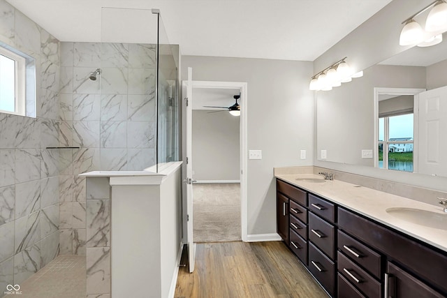 6762 Brentwood Ct, Brownsburg, IN 46112 - full bathroom with healthy amount of natural light, double vanity, wood finished floors, and walk in shower