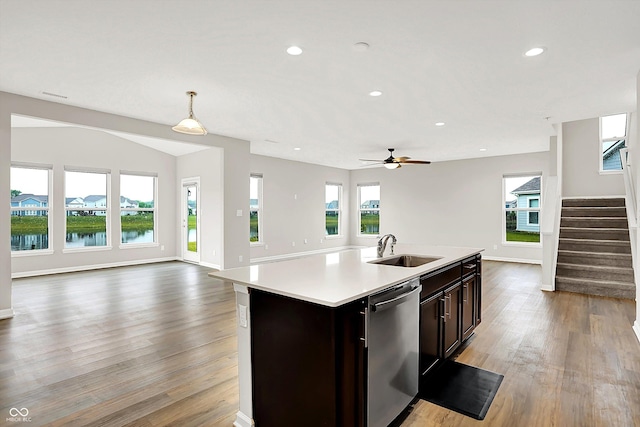 6762 Brentwood Ct, Brownsburg, IN 46112 - kitchen featuring stainless steel dishwasher, open floor plan, a sink, light countertops, and recessed lighting