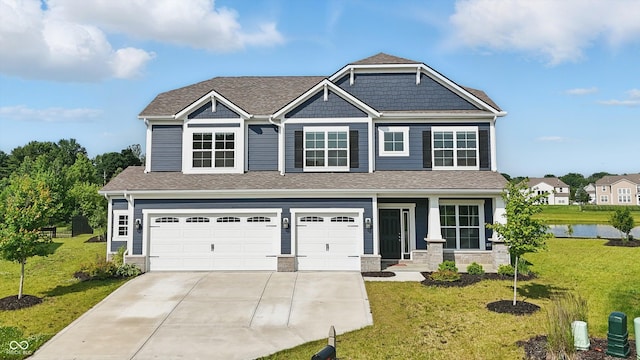 6762 Brentwood Ct, Brownsburg, IN 46112 - craftsman inspired home with concrete driveway, an attached garage, a front yard, and a water view