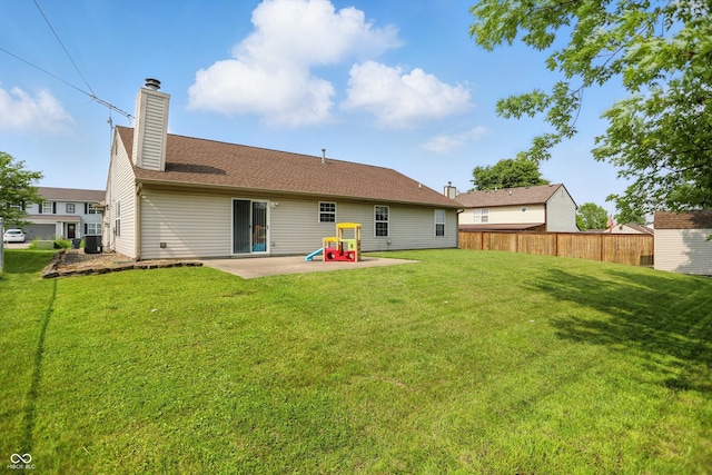 2145 W Autumn Ln, Columbus, IN 47201 - back of property with a patio area, a chimney, and central AC unit