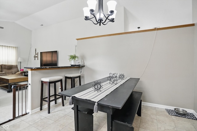 2145 W Autumn Ln, Columbus, IN 47201 - tiled dining room with vaulted ceiling, a chandelier, and baseboards