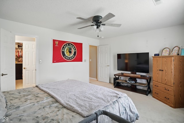 2145 W Autumn Ln, Columbus, IN 47201 - carpeted bedroom with a ceiling fan and a textured ceiling
