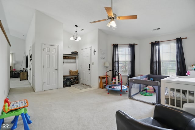 2145 W Autumn Ln, Columbus, IN 47201 - carpeted living room with lofted ceiling, a ceiling fan, and baseboards