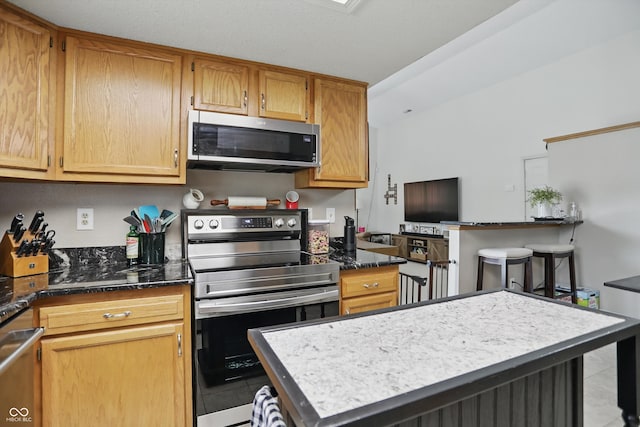 2145 W Autumn Ln, Columbus, IN 47201 - kitchen featuring appliances with stainless steel finishes and light tile patterned floors