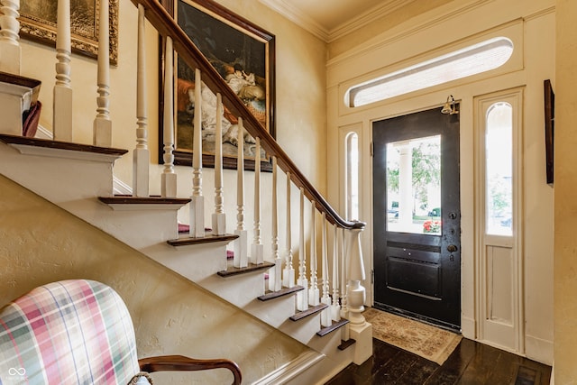 224 N Pennsylvania St, Greenfield, IN 46140 - foyer with healthy amount of natural light, ornamental molding, stairs, and dark wood finished floors