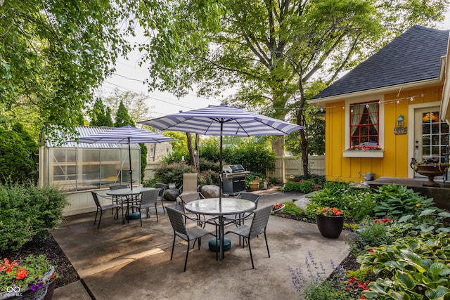 224 N Pennsylvania St, Greenfield, IN 46140 - view of patio featuring outdoor dining space, an outdoor structure, an exterior structure, and grilling area