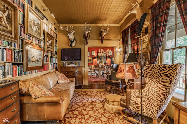 224 N Pennsylvania St, Greenfield, IN 46140 - living area with crown molding, wood finished floors, and an ornate ceiling