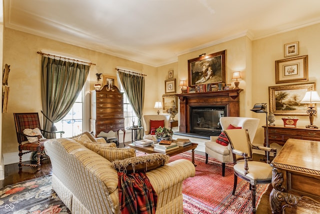224 N Pennsylvania St, Greenfield, IN 46140 - living room featuring wood finished floors, ornamental molding, a glass covered fireplace, and baseboards