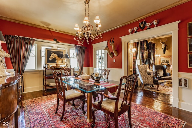 224 N Pennsylvania St, Greenfield, IN 46140 - dining area with a chandelier, wood finished floors, and ornamental molding