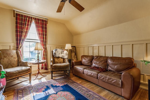 224 N Pennsylvania St, Greenfield, IN 46140 - living area with a decorative wall, ceiling fan, wainscoting, wood finished floors, and lofted ceiling