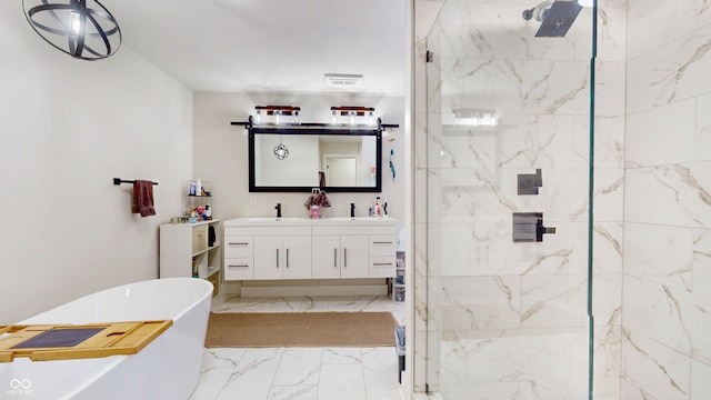 615 Orange St, Indianapolis, IN 46203 - full bathroom featuring double vanity, a freestanding tub, a marble finish shower, and marble finish flooring
