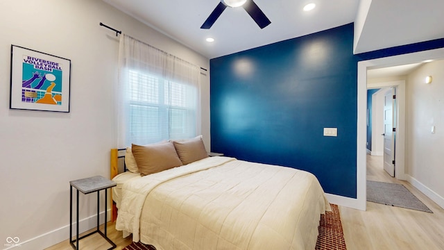615 Orange St, Indianapolis, IN 46203 - bedroom featuring light wood-type flooring, baseboards, ceiling fan, and recessed lighting