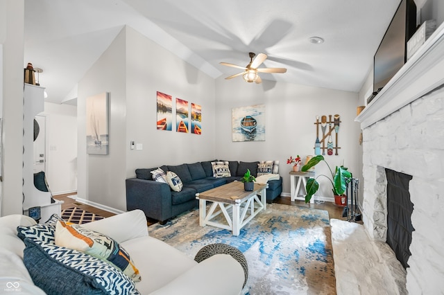 6933 Grey Wolf Dr, Hamblen Township, IN 46164 - living room featuring vaulted ceiling, a ceiling fan, baseboards, wood finished floors, and a fireplace