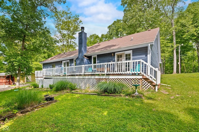 6933 Grey Wolf Dr, Hamblen Township, IN 46164 - back of house with a wooden deck, a lawn, a chimney, and a shingled roof