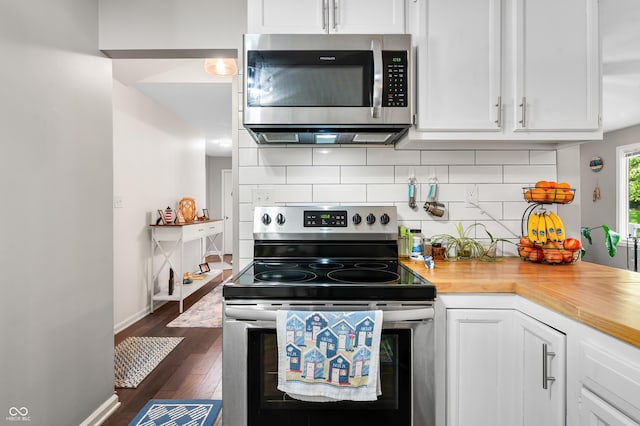 6933 Grey Wolf Dr, Hamblen Township, IN 46164 - kitchen featuring stainless steel appliances, white cabinetry, dark wood-type flooring, and decorative backsplash
