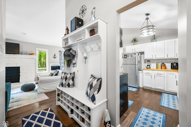 6933 Grey Wolf Dr, Hamblen Township, IN 46164 - mudroom featuring dark wood finished floors and a fireplace