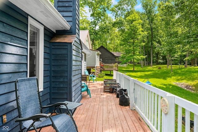 6933 Grey Wolf Dr, Hamblen Township, IN 46164 - wooden terrace featuring a lawn and view of wooded area