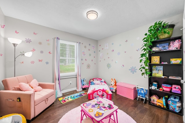 6933 Grey Wolf Dr, Hamblen Township, IN 46164 - playroom with wood finished floors, a textured ceiling, baseboards, and wallpapered walls