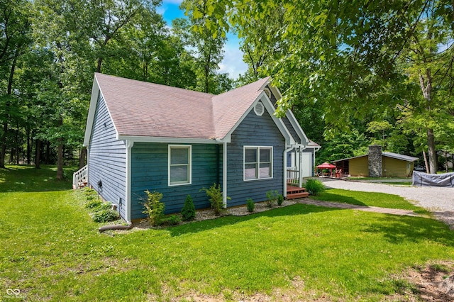 6933 Grey Wolf Dr, Hamblen Township, IN 46164 - view of front of property featuring roof with shingles, a front yard, and driveway