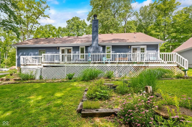 6933 Grey Wolf Dr, Hamblen Township, IN 46164 - rear view of house featuring a lawn, a chimney, and a deck
