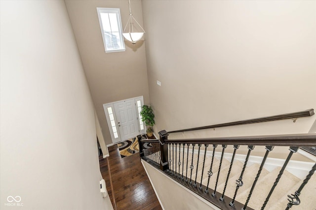 5767 Bluff View Ln, Whitestown, IN 46075 - entrance foyer featuring dark wood-type flooring and stairs