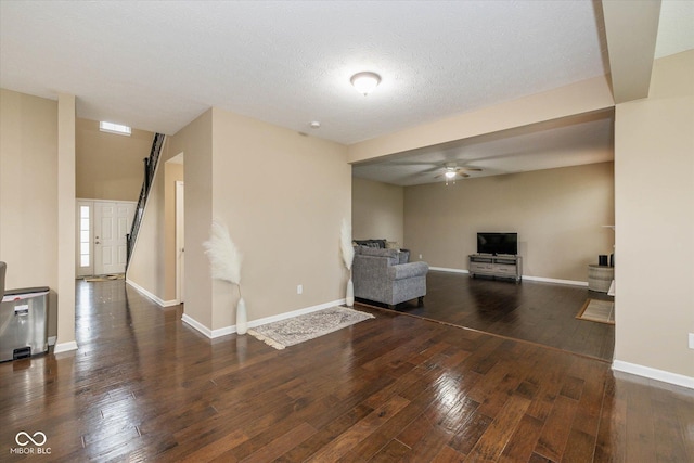 5767 Bluff View Ln, Whitestown, IN 46075 - unfurnished living room featuring hardwood / wood-style flooring, baseboards, and ceiling fan