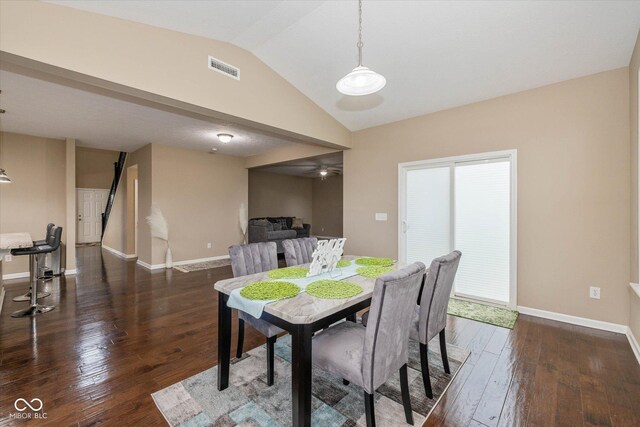 5767 Bluff View Ln, Whitestown, IN 46075 - dining room featuring lofted ceiling, hardwood / wood-style flooring, baseboards, and a ceiling fan
