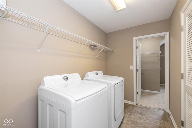 5767 Bluff View Ln, Whitestown, IN 46075 - laundry area with independent washer and dryer and baseboards
