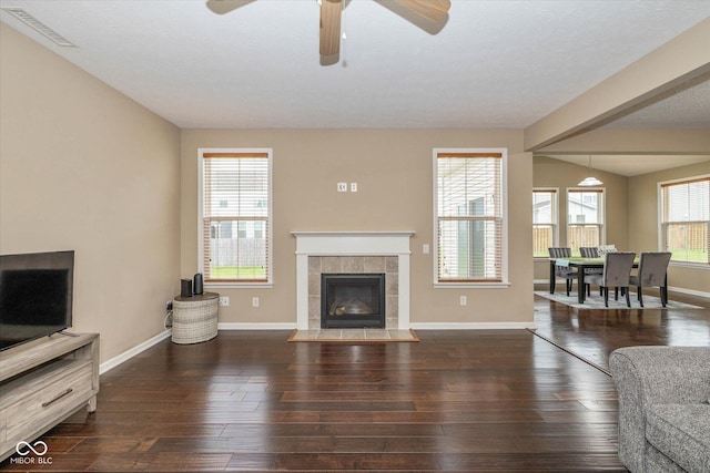 5767 Bluff View Ln, Whitestown, IN 46075 - living room with baseboards, ceiling fan, hardwood / wood-style floors, and a fireplace