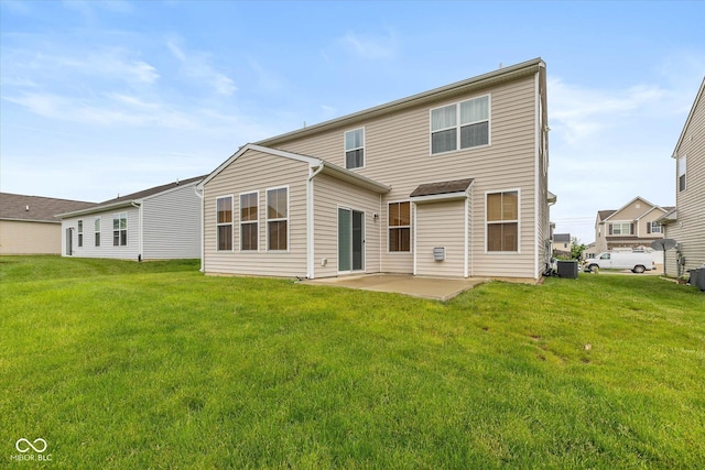 5767 Bluff View Ln, Whitestown, IN 46075 - back of property with central AC unit, a patio, and a yard