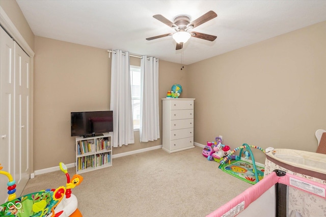 5767 Bluff View Ln, Whitestown, IN 46075 - playroom with baseboards, carpet flooring, and ceiling fan