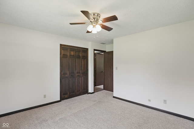 8510 N Carroll Rd, Indianapolis, IN 46236 - unfurnished bedroom featuring light colored carpet, a closet, baseboards, and a ceiling fan